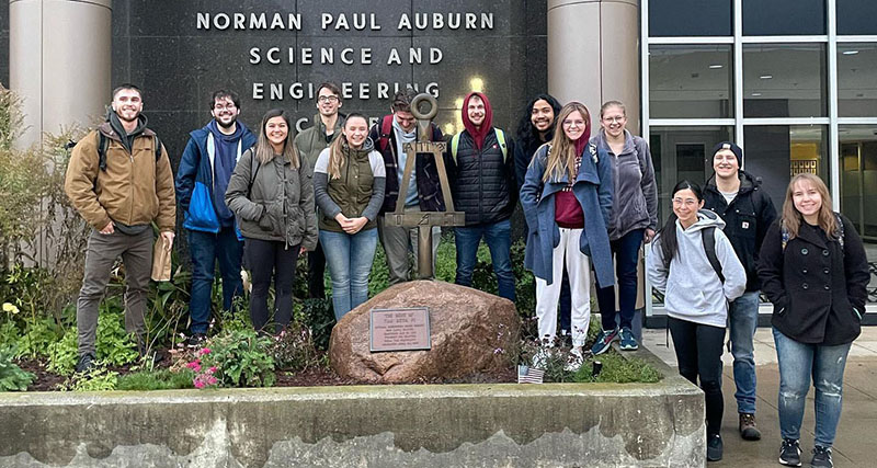 Tau Beta Pi chapter posting in front of building at Auburn Univerisity.