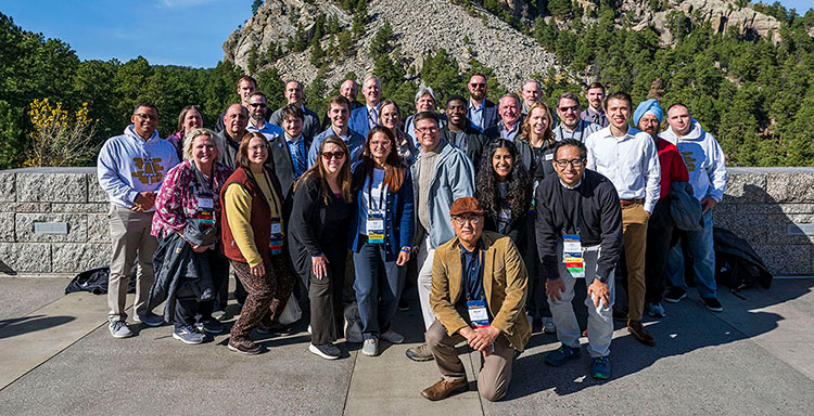 Group of alumni members posing during convention.