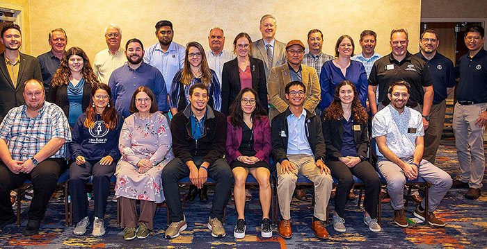 Group of alumni members posing together during Convention.