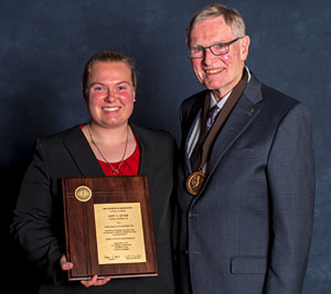 Group of officers standing outside talking during convention.
