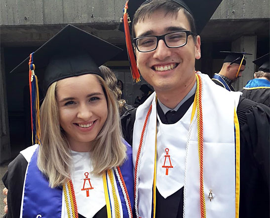 Members posing after a graduation.