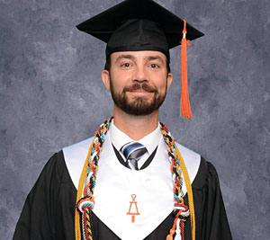 Group of students using a laptop during Convention.